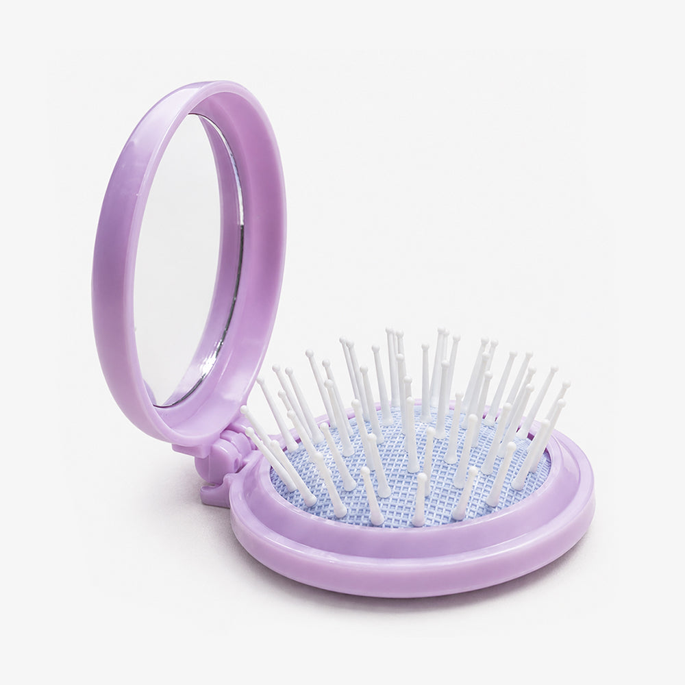 Lavender folding hair brush with built-in mirror, white bristles, and blue cushioned base