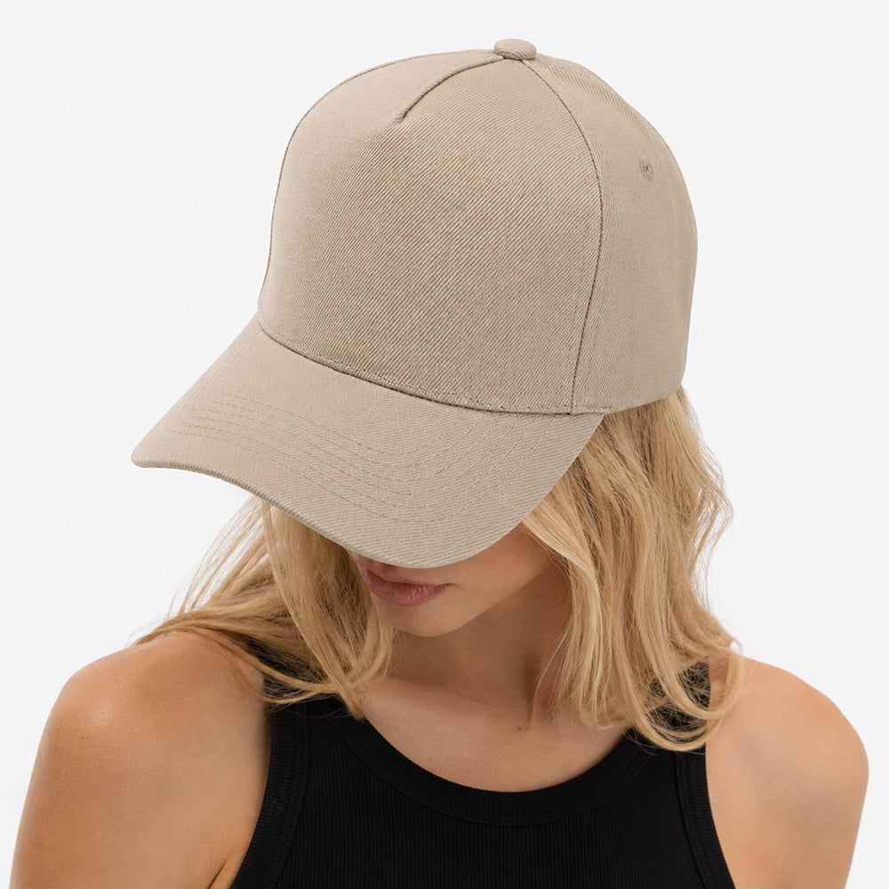 Beige five-panel baseball cap with structured crown, curved brim, and visible stitching details