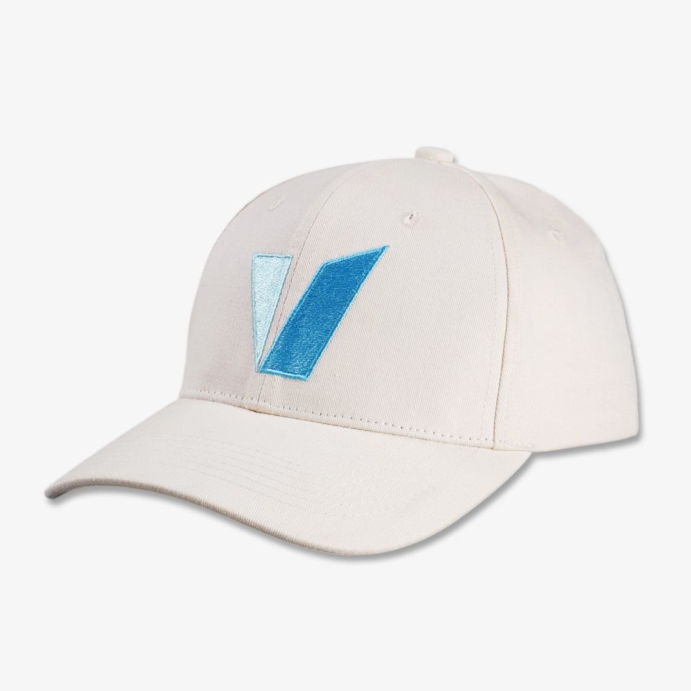 Classic six-panel baseball cap in off-white cotton twill with a blue embroidered V-shaped detail on the front