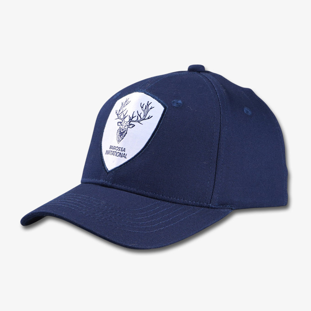 Navy blue six-panel baseball cap with a white shield-shaped patch featuring a deer head design