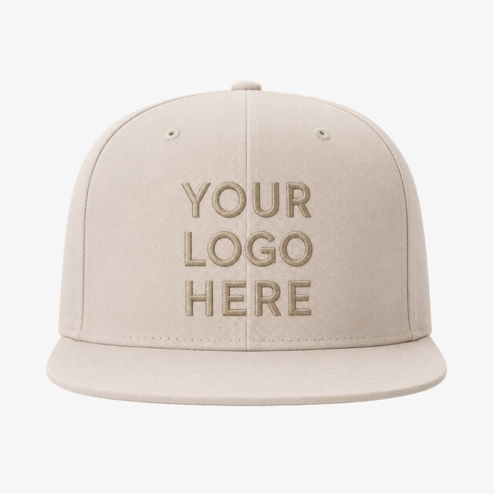 Beige six-panel snapback cap with flat brim and tonal embroidered front panel
