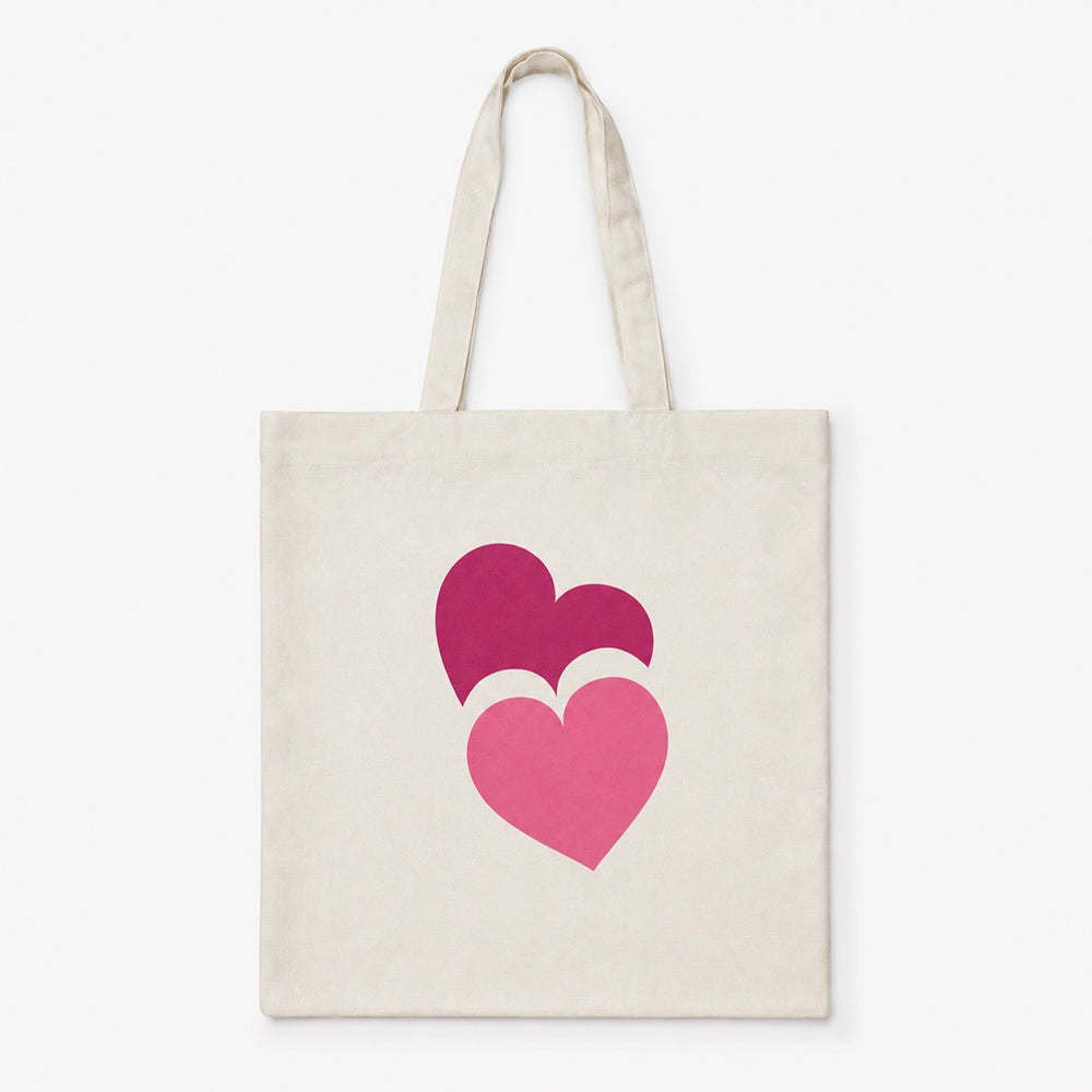 Basic natural canvas tote bag printed with two overlapping dark pink and light pink heart designs