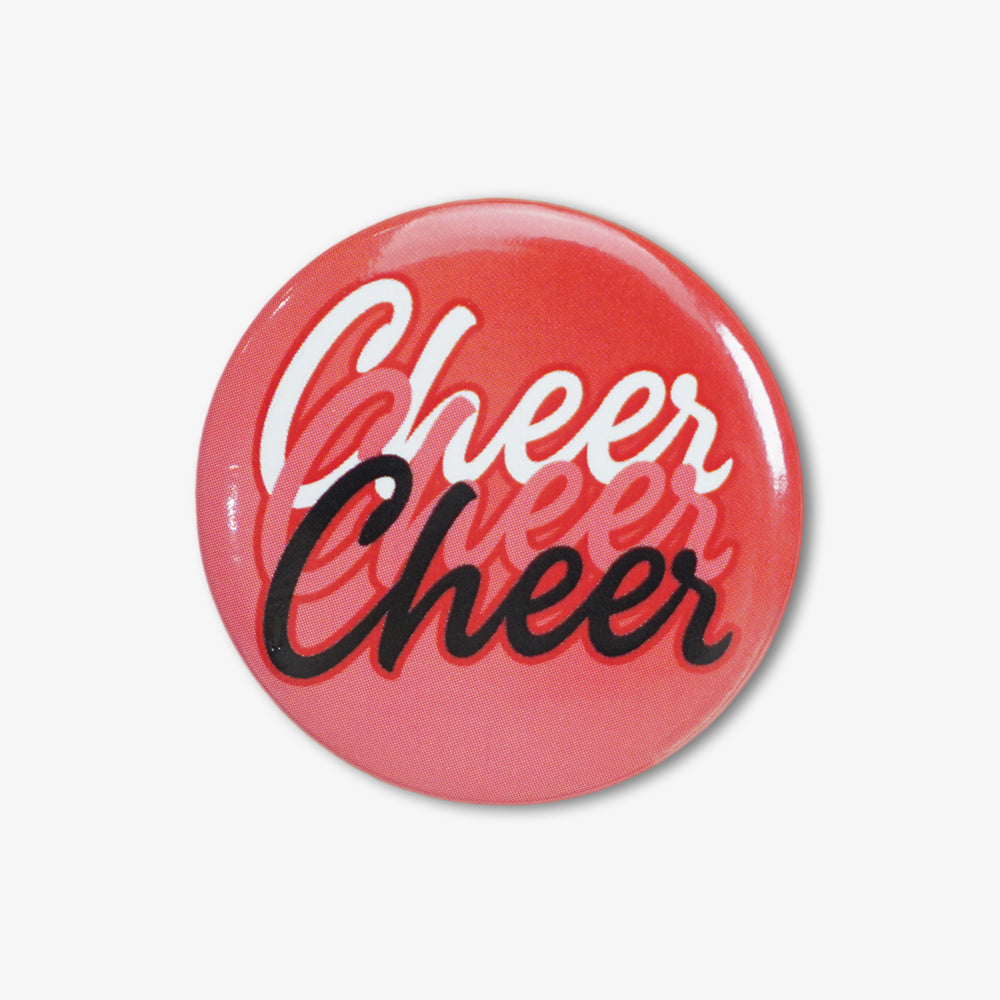 Glossy red gradient button badge with stacked cursive "Cheer" lettering in white, black and light pink
