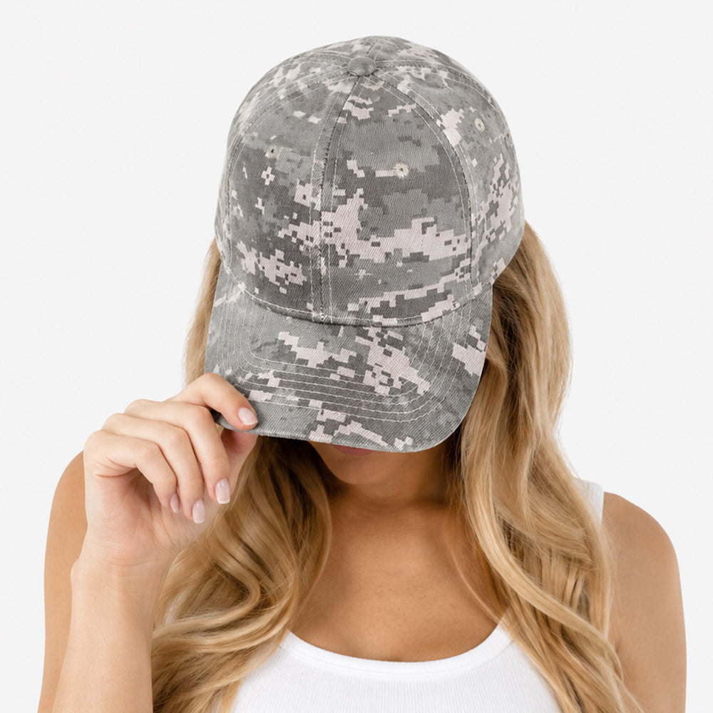 Camouflage baseball cap with digital pixel pattern in gray and beige tones, structured crown and curved brim