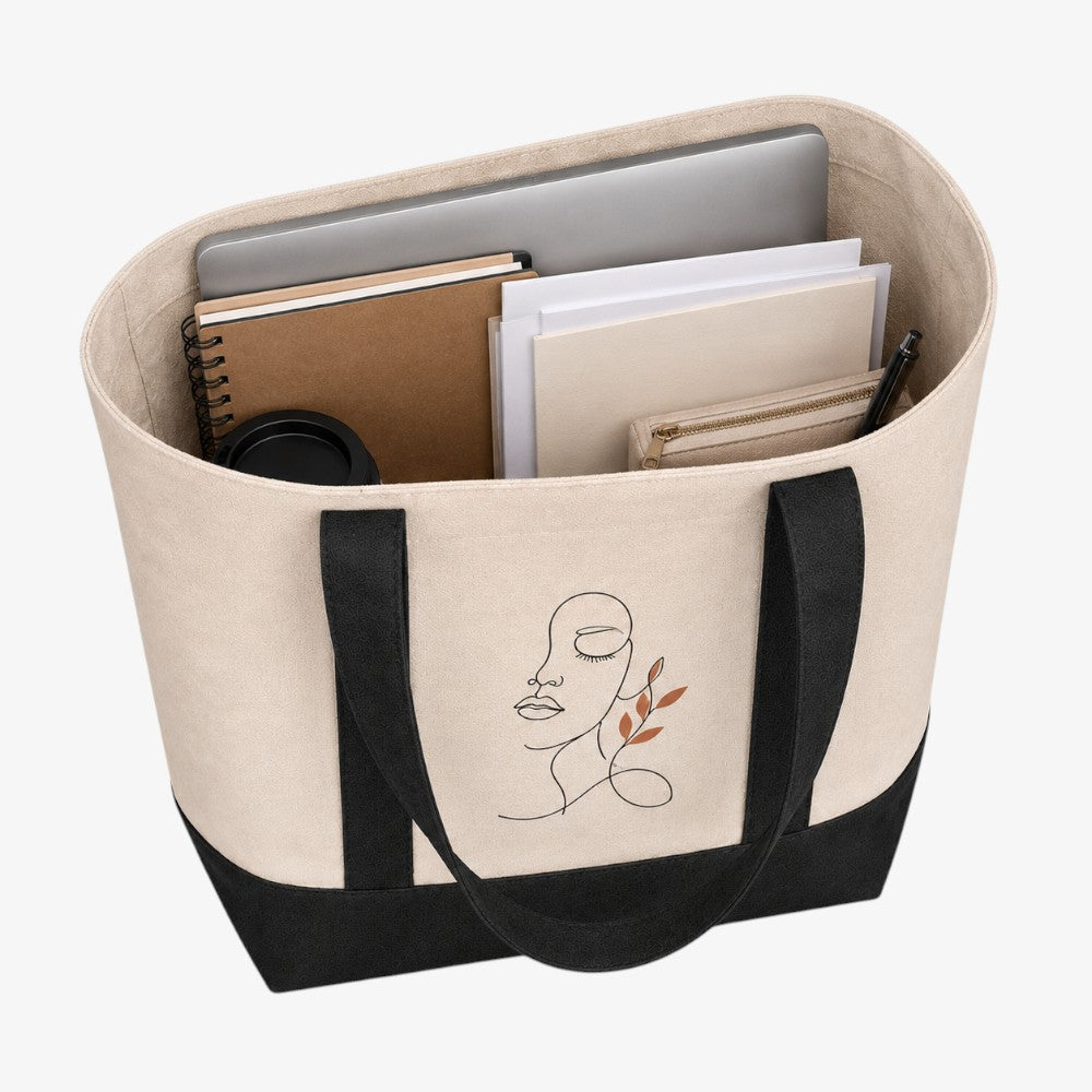Beige and black Canvas Boat Tote Bag with abstract line face print, holding laptop, notebooks and stationery to show its spacious interior