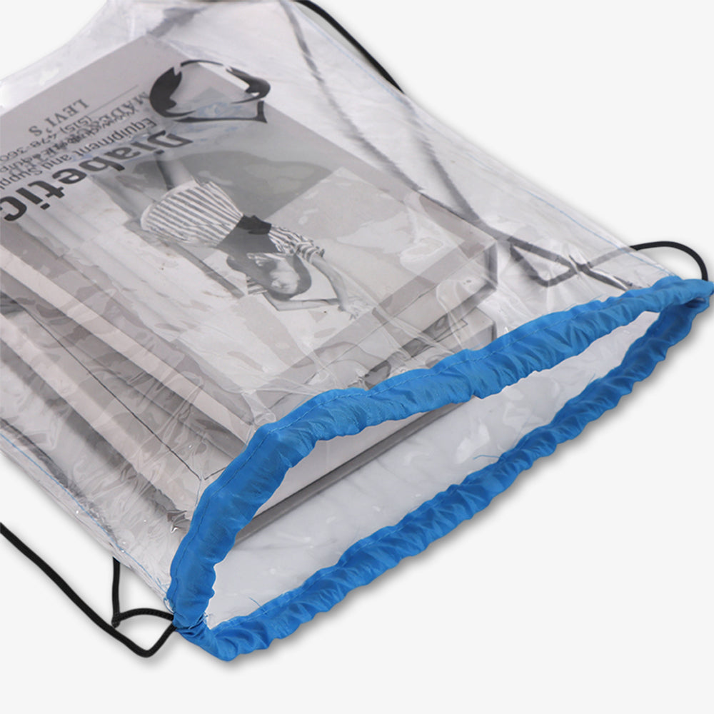 Clear drawstring bag with bright blue trim and black drawstrings, transparent PVC material holding stacked books inside