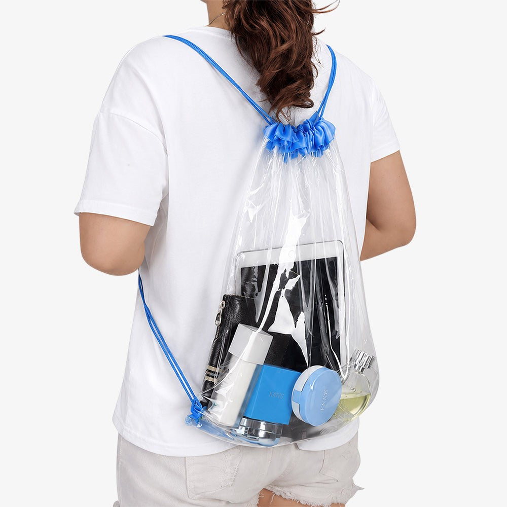 Clear drawstring bag with bright blue drawstrings, transparent PVC backpack holding daily essentials worn on a person's back