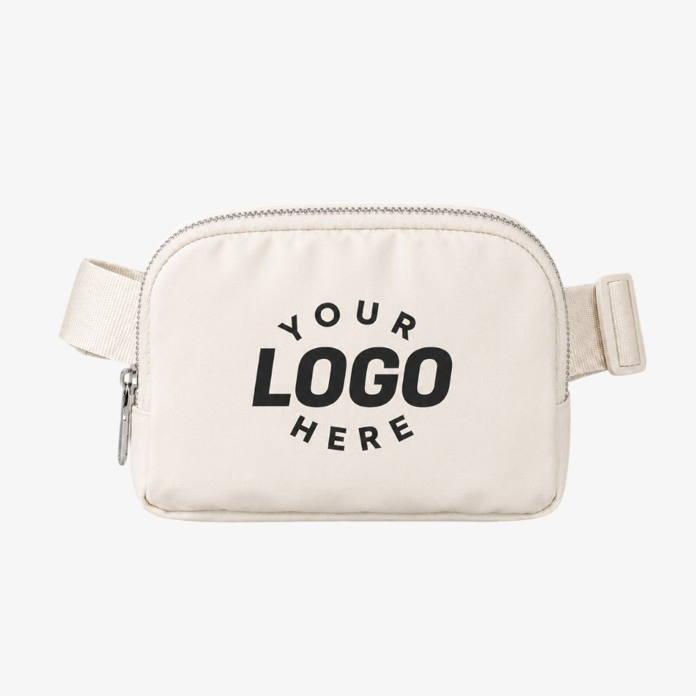 Cream-colored canvas cross body fanny pack with silver zipper and adjustable strap