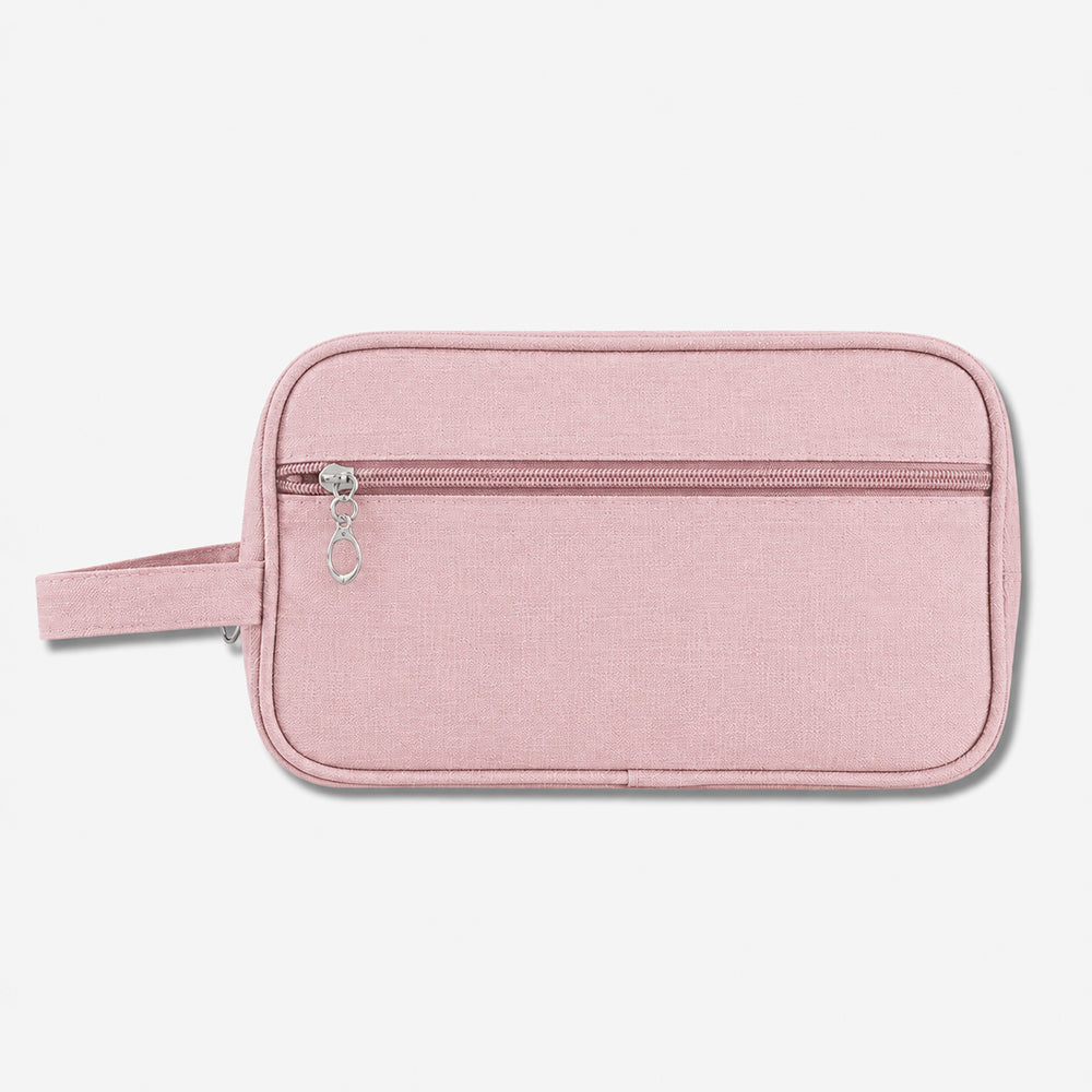 Pink fabric toiletry bag with a front zippered pocket and attached loop handle