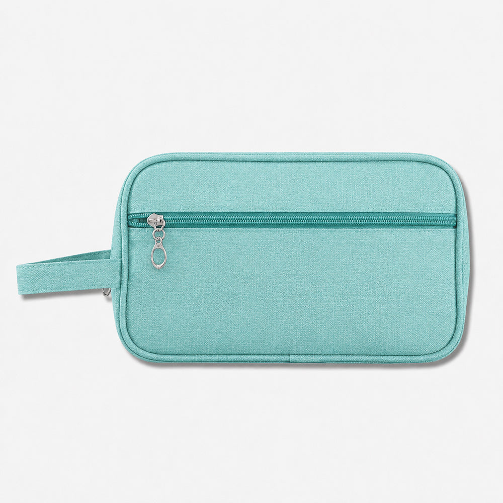 Mint green fabric toiletry bag with top zipper closure and side loop handle