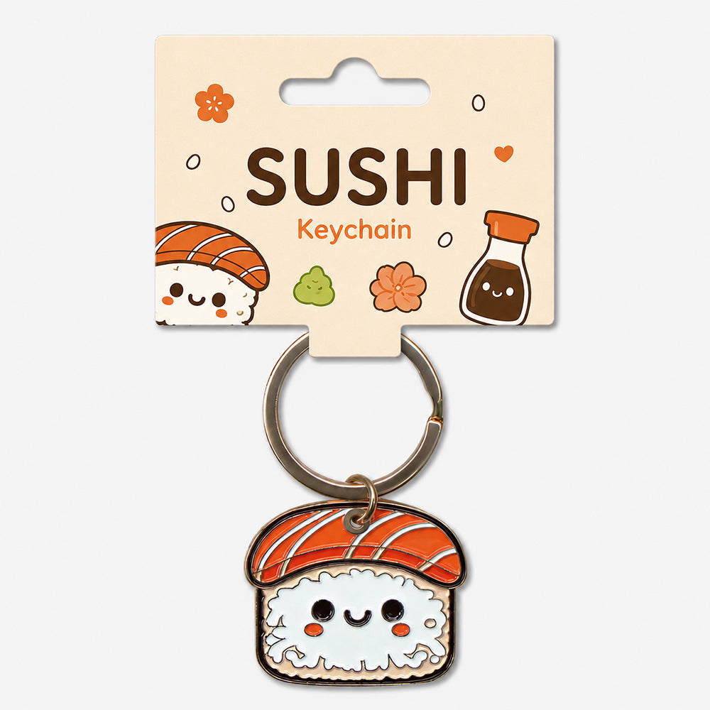 Sushi-shaped enamel keychain with orange fish topping, white rice base, and smiling face details