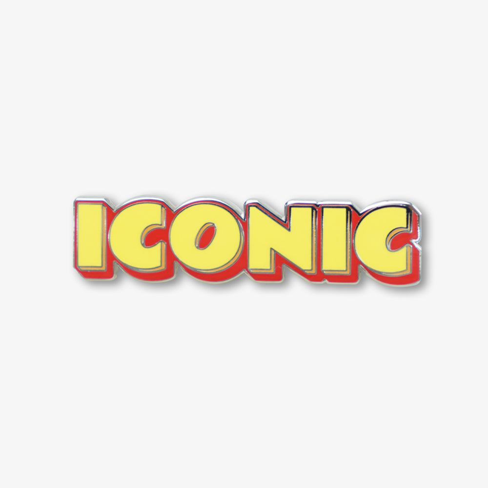 Hard enamel pin with bold yellow "ICONIC" lettering, red background and shiny silver metal border
