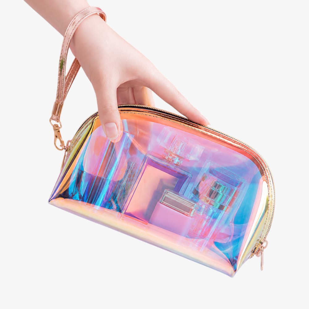 Holographic makeup bag with iridescent rainbow sheen, gold zipper, and detachable wrist strap