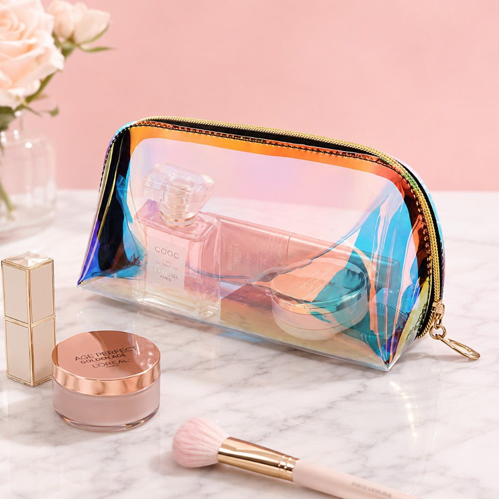 Holographic makeup bag with iridescent rainbow sheen, gold zipper, and transparent body showing contents