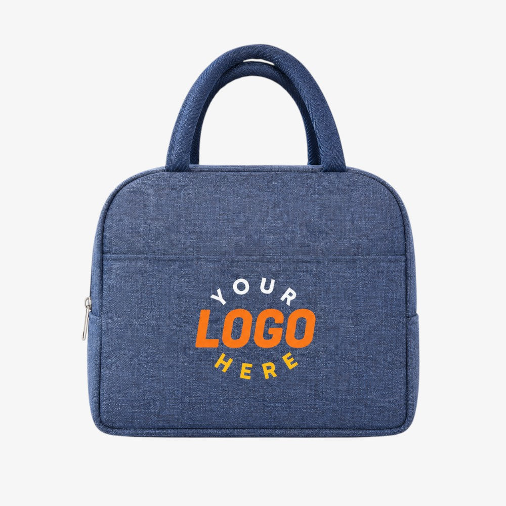 Insulated lunch bag in textured navy blue fabric with top handles and a front zippered pocket
