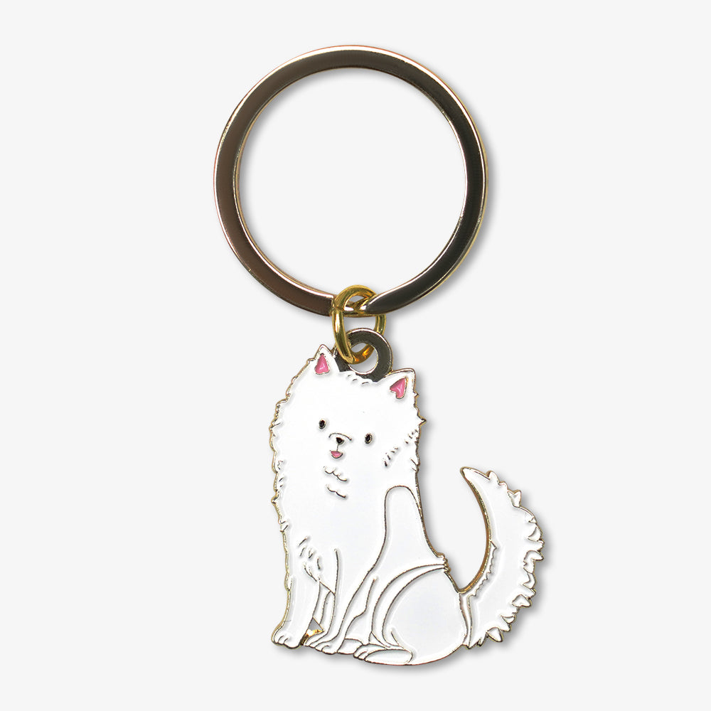 Metal enamel keychain featuring a cute sitting white fluffy Samoyed dog charm, gold toned metal key ring