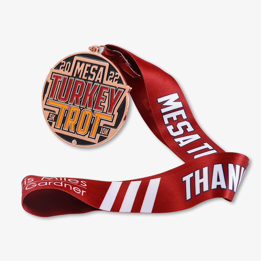 Metal medal for 2022 Mesa Turkey Trot 5K 10K, rose gold finish with printed red satin ribbon