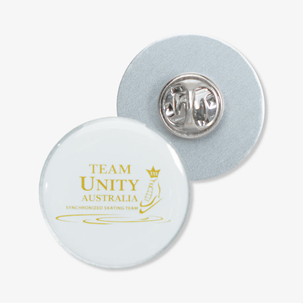 Photo Dome Pin printed with gold Team Unity Australia synchronized skating team logo, showing front face and metal clutch back