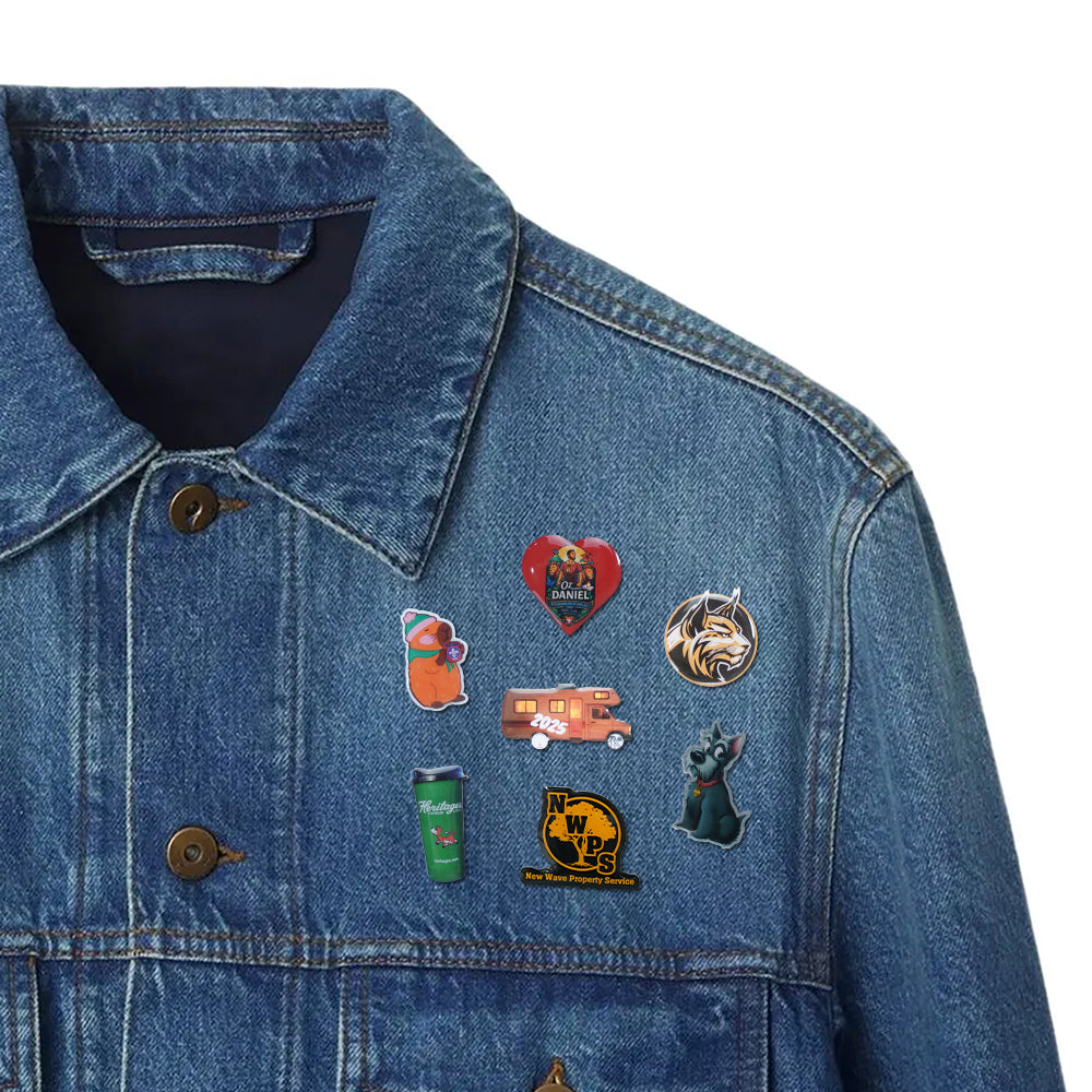 Photo Dome Pins with various fun graphic designs pinned on a classic blue denim jacket for outfit decoration