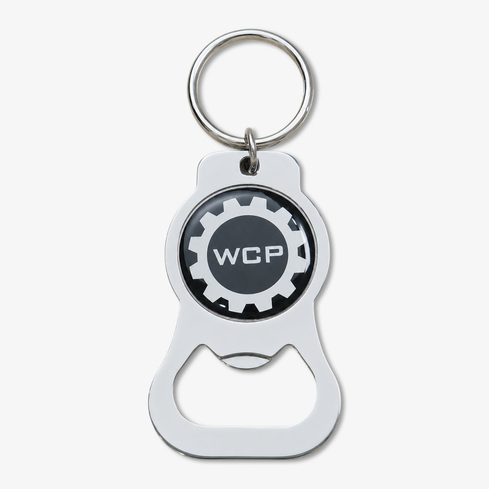 Polished silver Photodome bottle opener keychain with custom WCP gear logo on black enamel badge