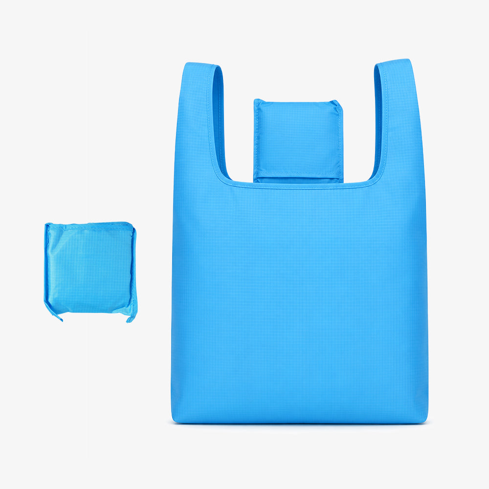 Bright blue polyester foldable tote bag, showing its full unfolded size and compact folded small pouch