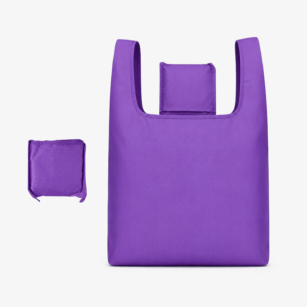 Bright purple polyester foldable bag, showing both full expanded tote form and compact folded pouch