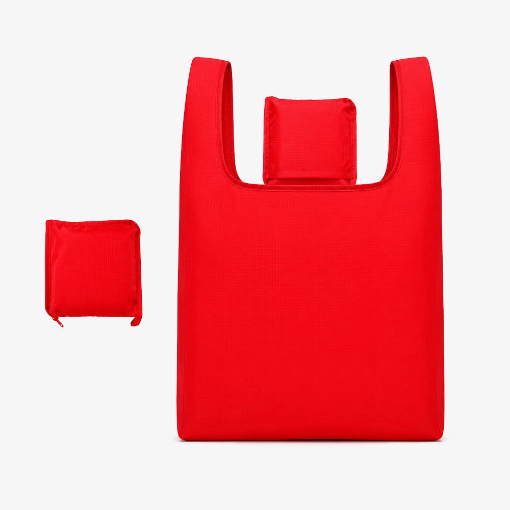 Bright red polyester foldable shopping bag, displaying the full unfolded tote and its small folded zipper storage pouch