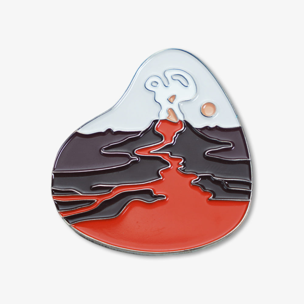 Premium metal fridge magnet with enamel erupting volcano design, featuring flowing red lava and tiny sun detail