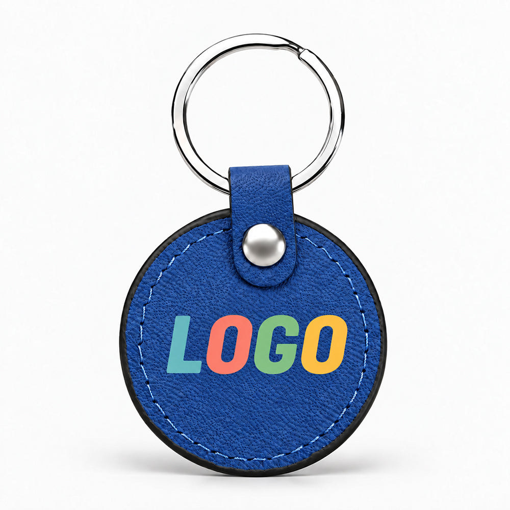 Round blue PU leather keychain with silver ring, stitched edge, and metallic snap fastener