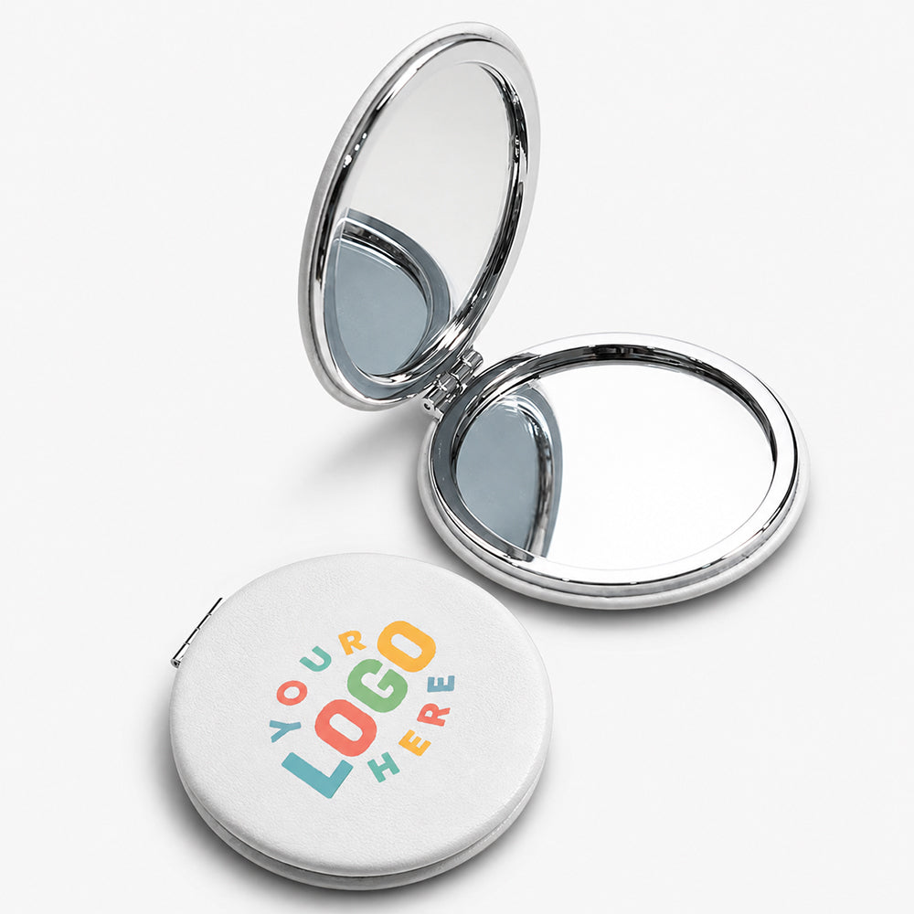 White PU leather compact mirror with silver hinge and dual circular mirrors, one side closed showing textured surface