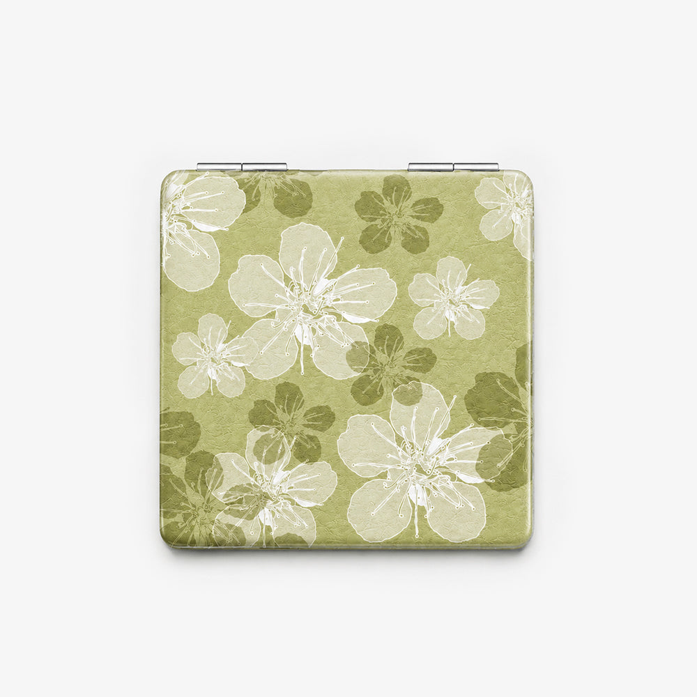 Folding compact mirror in olive green PU leather with white and dark green floral print and silver hinge