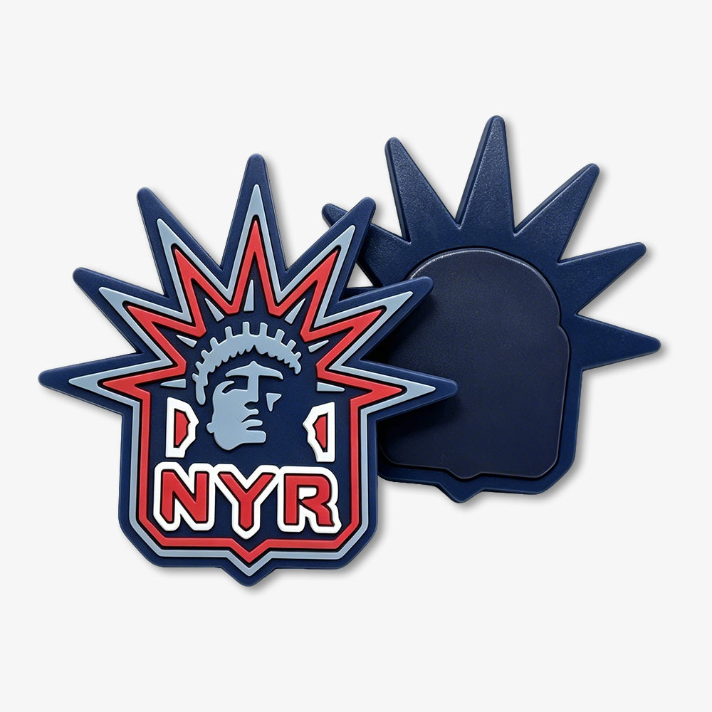 PVC fridge magnets with NYR Statue of Liberty logo, showing the decorative front and dark blue magnetic back