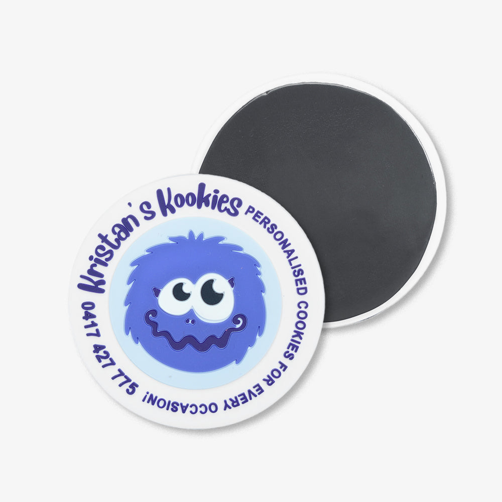 PVC fridge magnets, custom round style with blue cartoon monster print, showing front design and black magnetic back