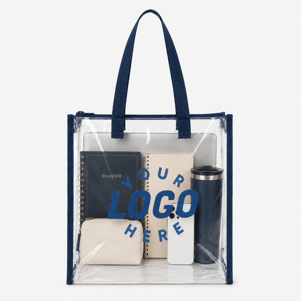 Clear PVC tote bag with navy blue handles and trim, customizable logo area, holding daily office essentials