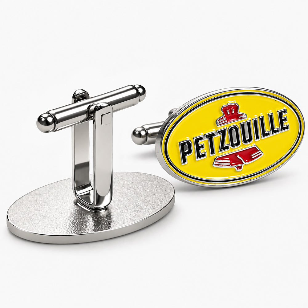 Oval soft enamel cufflinks with bright yellow background, red graphic details, and polished silver-tone metal frame and toggle fastener