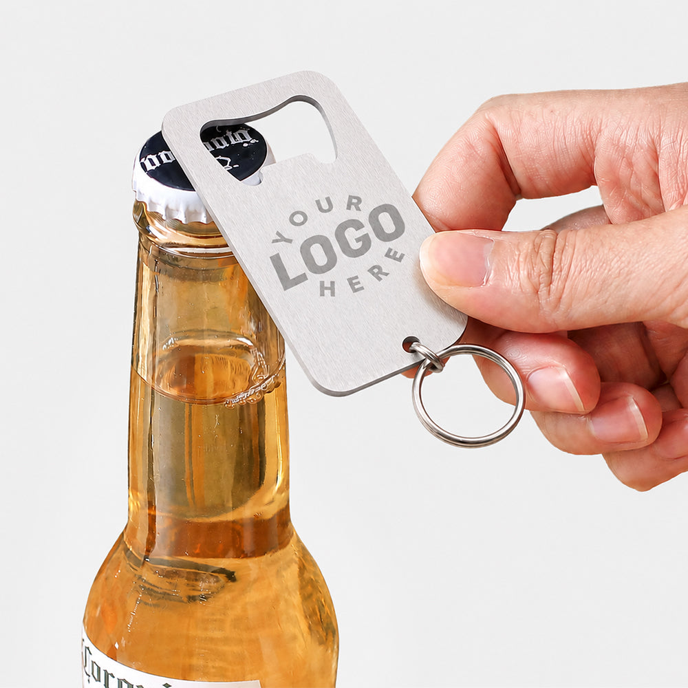 Stainless steel key ring bottle opener with custom logo reserved space opening a glass beer bottle