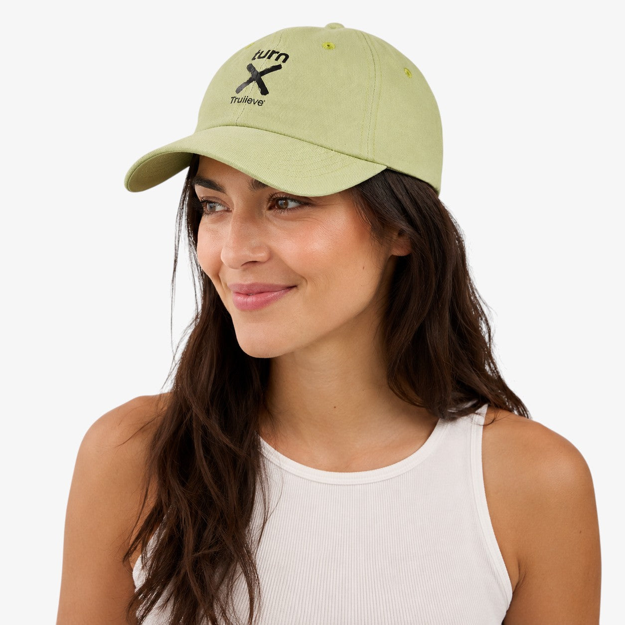 Light green unstructured dad hat with curved brim, embroidered front design, and visible eyelets