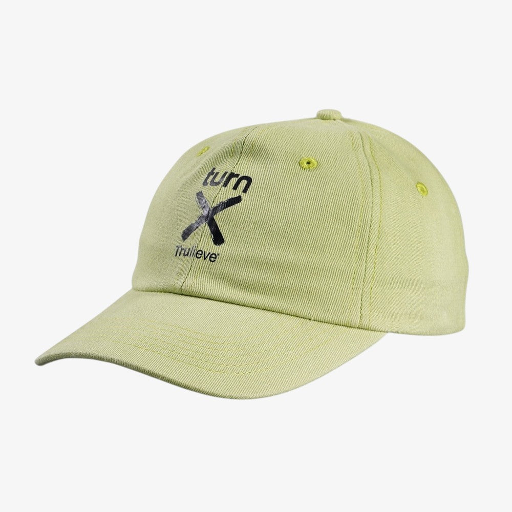 Light green unstructured dad hat with black graphic embroidery and matching fabric-covered buttons