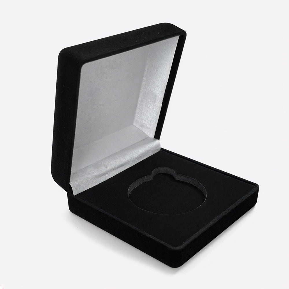 Open black velvet coin box with white satin inner lining and circular coin storage cutout