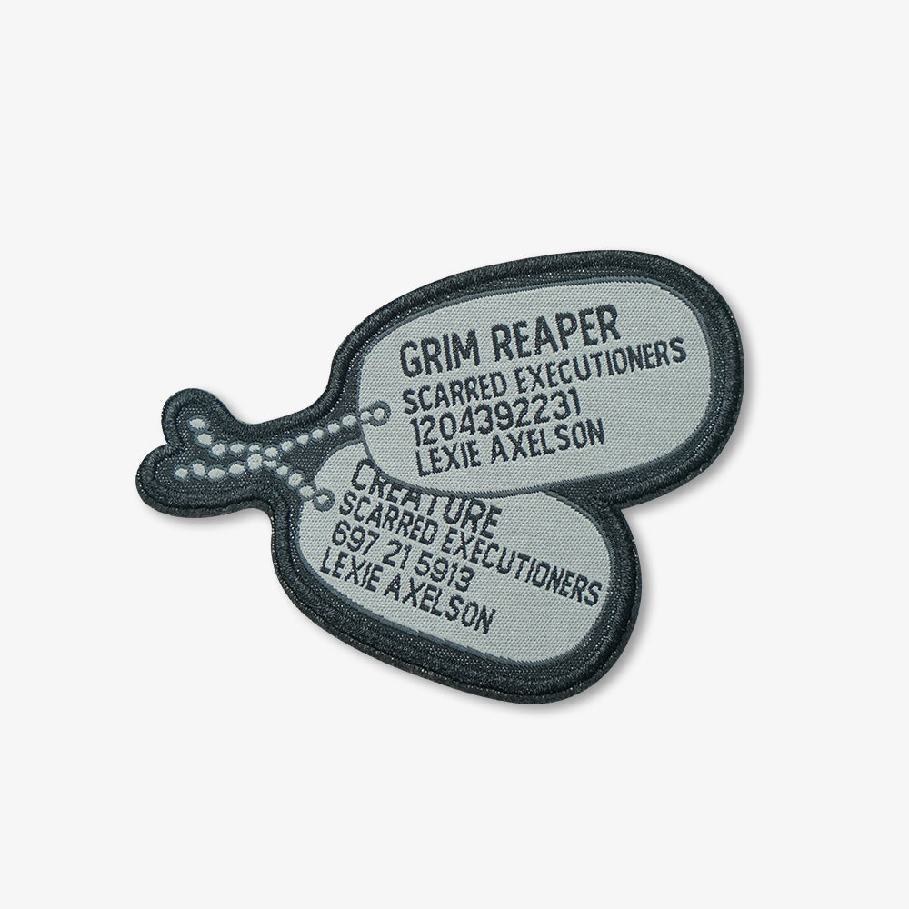 Woven patches shaped as double military dog tags, dark grey embroidered border with custom text on light grey woven fabric